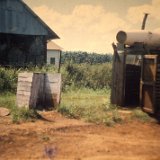 "An Improvised Hot Shower - Quan Loi June 1967 - ABtry 6/27th Arty"
